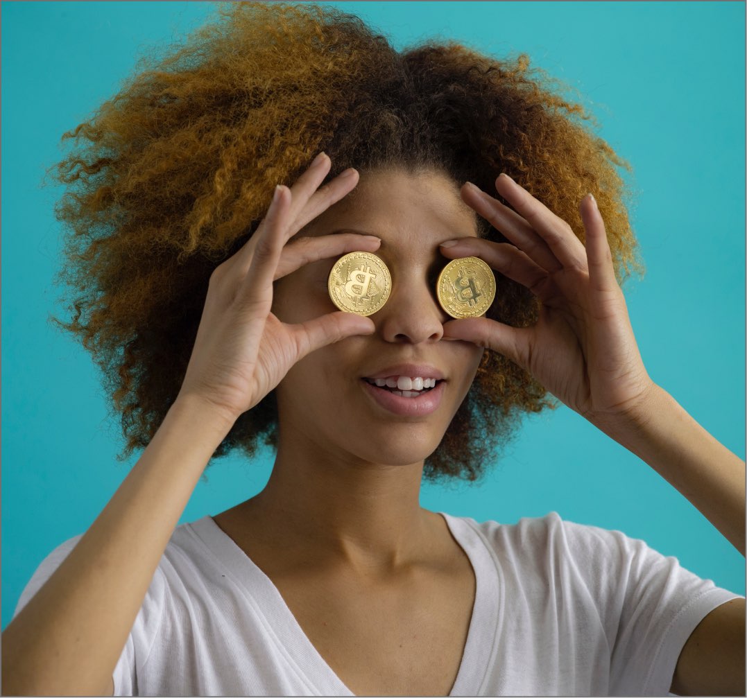 girl holding cucumbers on eyes