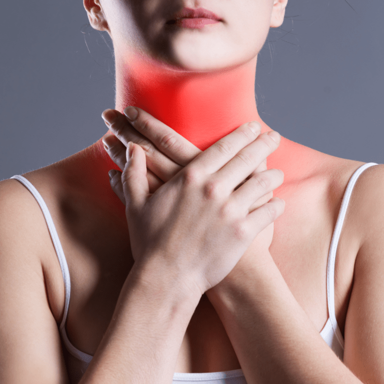 Woman with hands on neck. Neck area is red indicating pain.